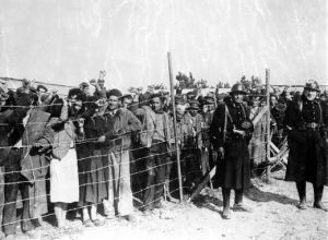 Pre-World War II, 8th February 1939, Argeles-sur-Mer, France, Spanish refugee soldiers behind a barbed wire enclosure at an internment camp, after their escape into France from Catalonia (Photo by Popperfoto/Getty Images)